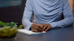 businesswoman writing a list