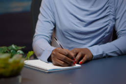 businesswoman writing a list