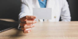 woman showing blank name card